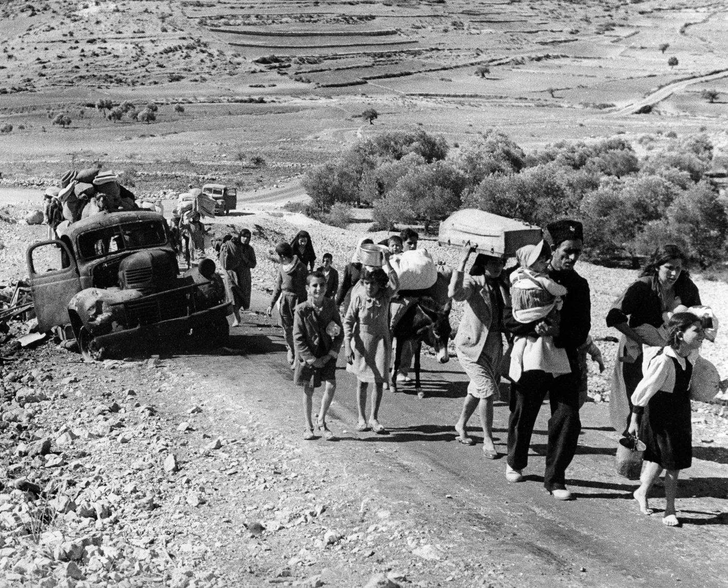 Arab refugees on the Lebanon Road after fleeing their homes in the Galilee during fighting between Israeli and Arab forces, November 1948.,
