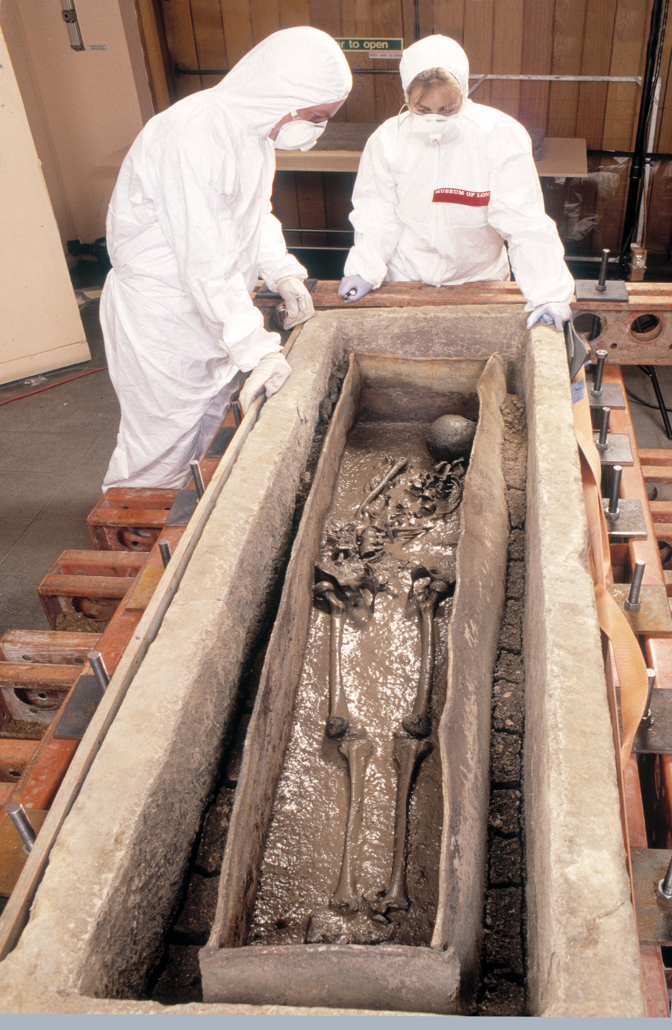 Conservators inspecting the skeleton of the Spitalfields Roman woman inside the lead coffin (c) MOLA.jpg