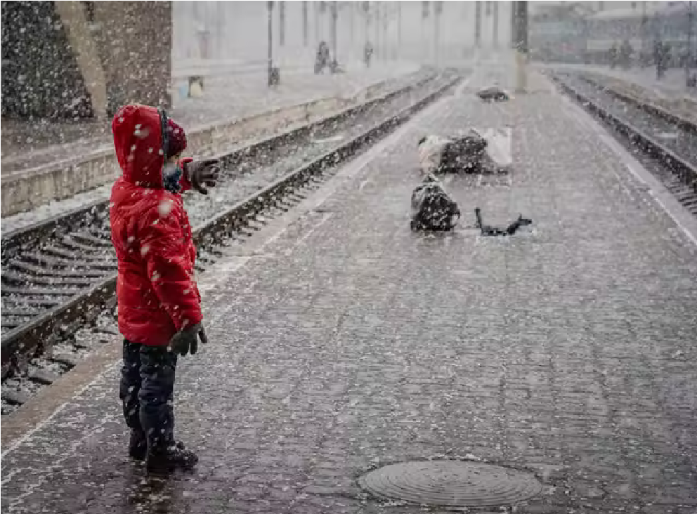 A little boy from Eastern Ukraine waits in the snow for a train to Poland (Bel Trew).png