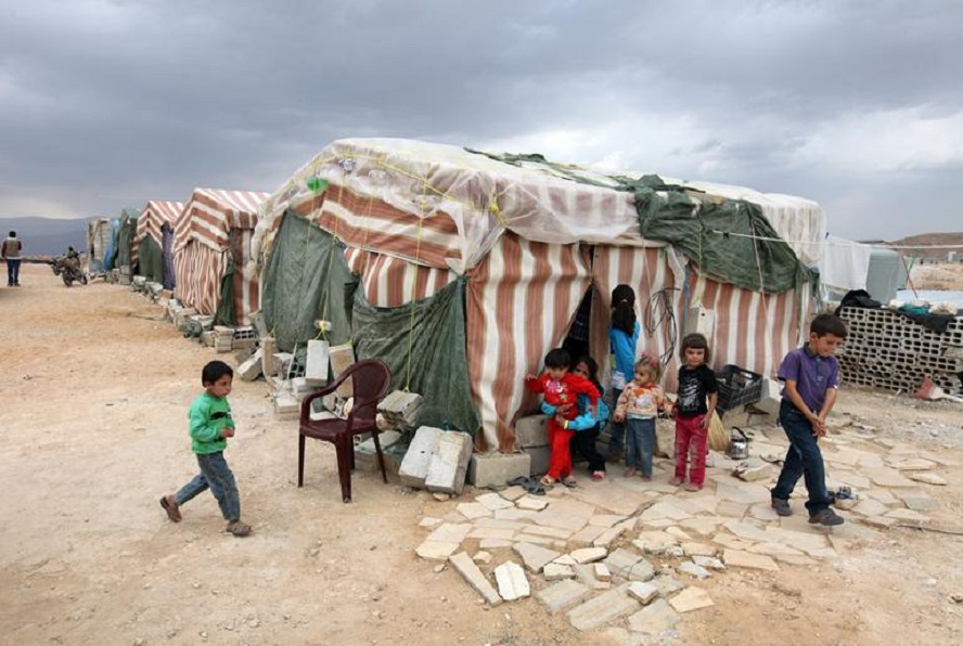 Syrian_refugees_children_stand_in_front_of_their_tents_at_a_refugee_camp_last_month_in_Arsal_AP.jpg