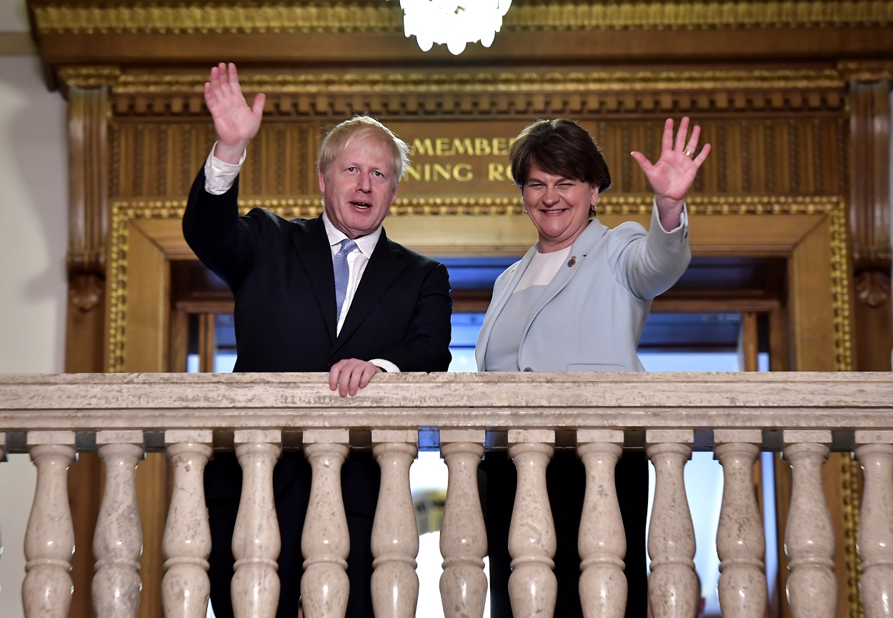 Mr Johnson meets with then-DUP leader Arlene Foster at Stormont in July 2019_getty.jpg