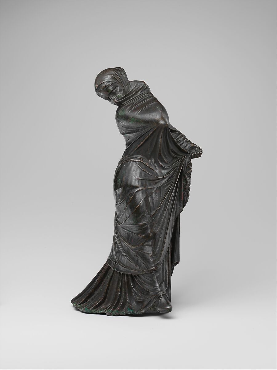 Bronze statuette of a veiled and masked dancer.jpg