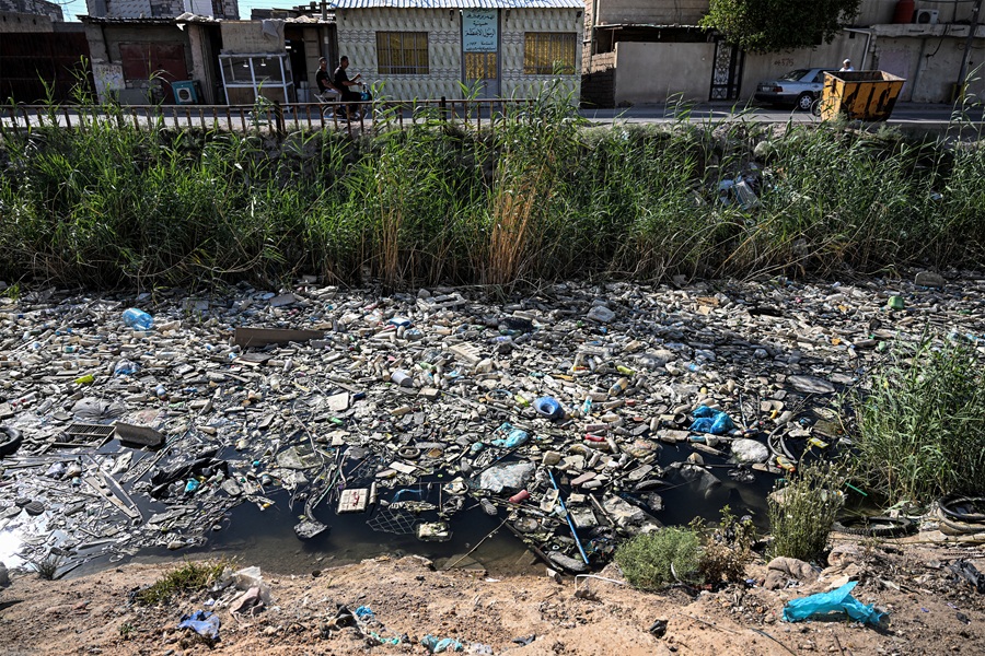 AFP__20240604__34V89EV__v2__HighRes__IraqEnvironmentWaterPollutionPlastic.jpg