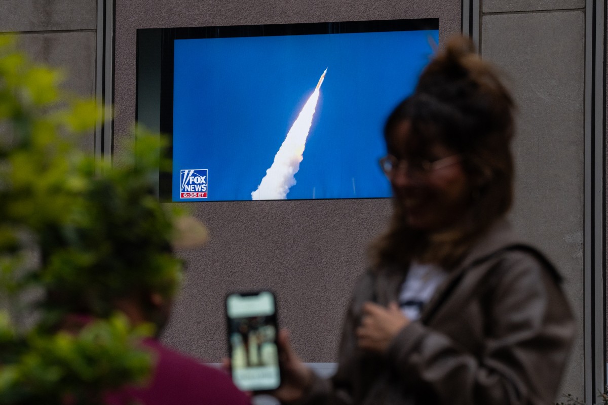 AFP__20260401__2268824262__v1__MidRes__PeopleWatchTheArtemisIiMoonMissionLaunchInMid.jpg