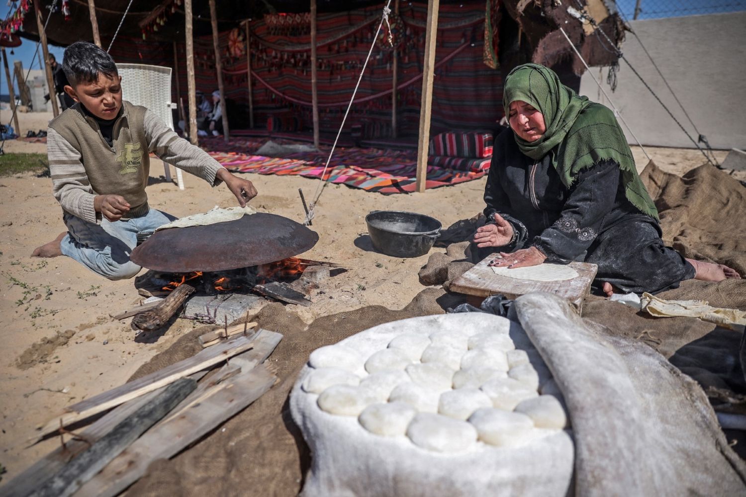 AFP__20230308__33AR4FR__v1__MidRes__PalestinianGazaWomenMarch8.jpg
